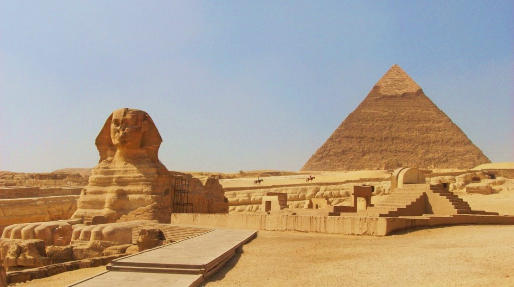 the sphinx at gizacairo in egypt with the pyramid of chephren khafre in the background 1 1 1 1
