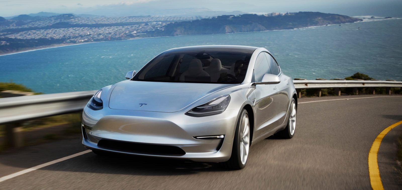 tesla model 3 silver prototype promo shot headlands